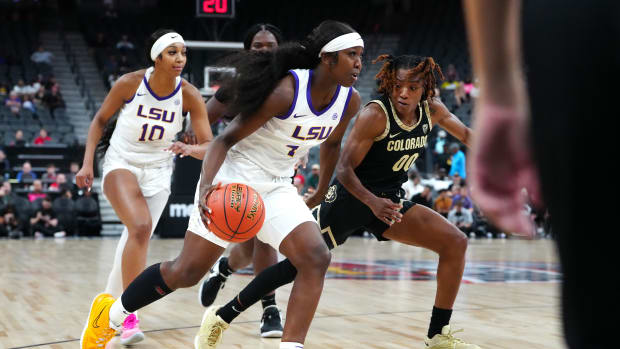 Nov 6, 2023; Las Vegas, Nevada, USA; LSU Lady Tigers guard Flau'jae Johnson (4) dribbles against Colorado Buffaloes guard Jaylyn Sherrod (00) during the second quarter at T-Mobile Arena.